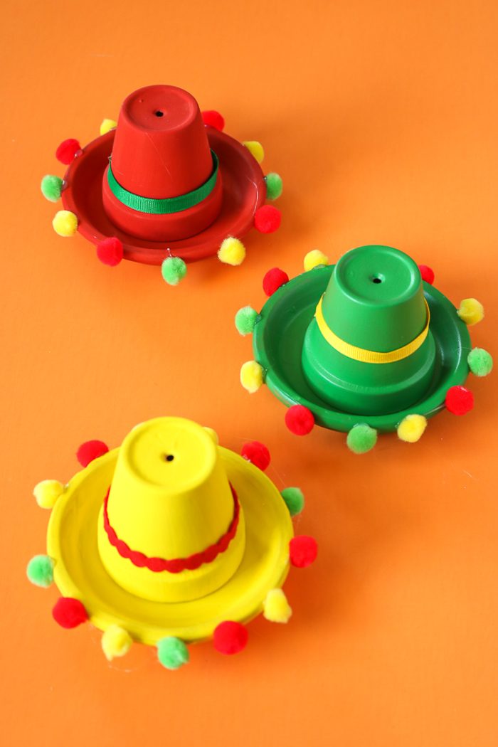 Clay garden pots decorated as Sombreros.