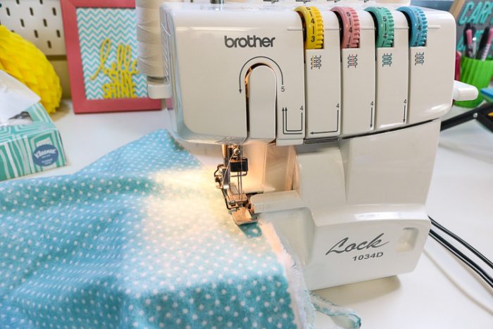 Using a Serger to finish the edges of a diy swaddle blanket.