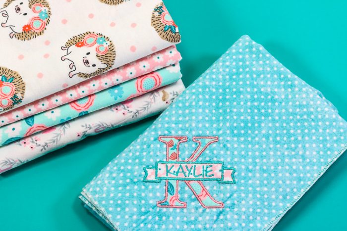 Baby blankets made from snuggle flannel and a serger. One is embroidered with a letter applique and name.
