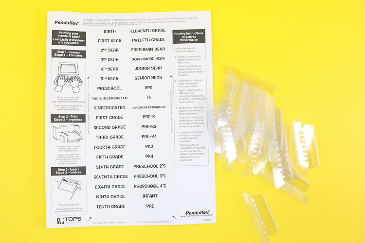 Printed sheet of tabs with plastic tab inserts