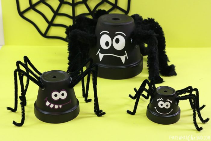 Three clay pots turned into spider decor