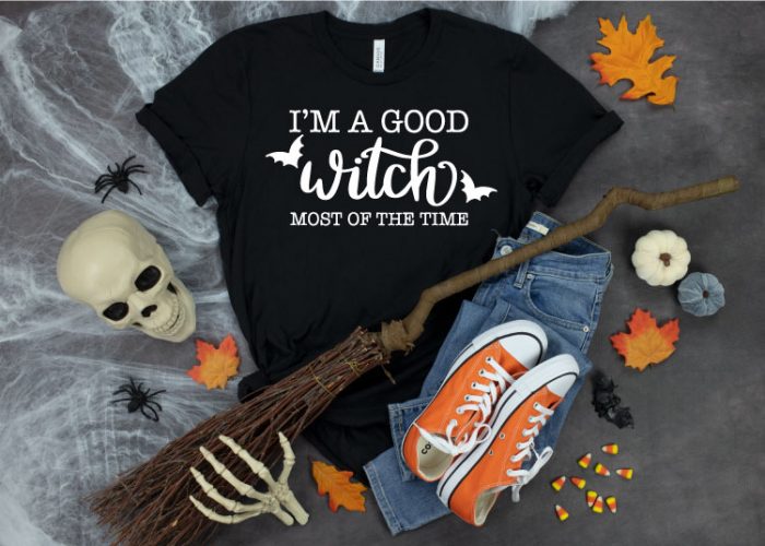 Black T-shirt with Halloween decorations around it and I'm A good Witch in Iron on