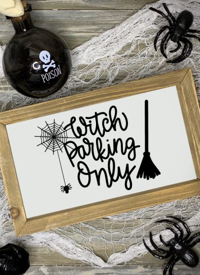 Halloween scene with "Witch Parking Only" Sign