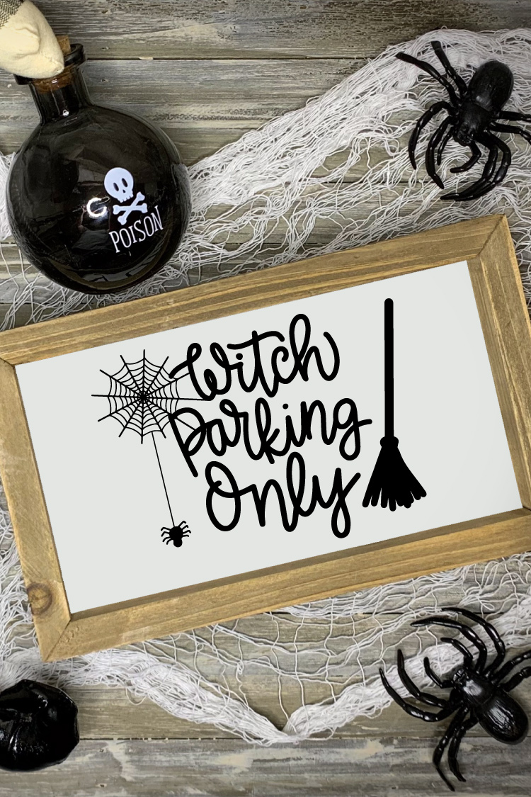 Halloween scene with "Witch Parking Only" Sign