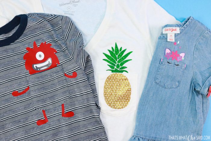 Three shirts with designs on the pockets, monster, pineapple and unicorn