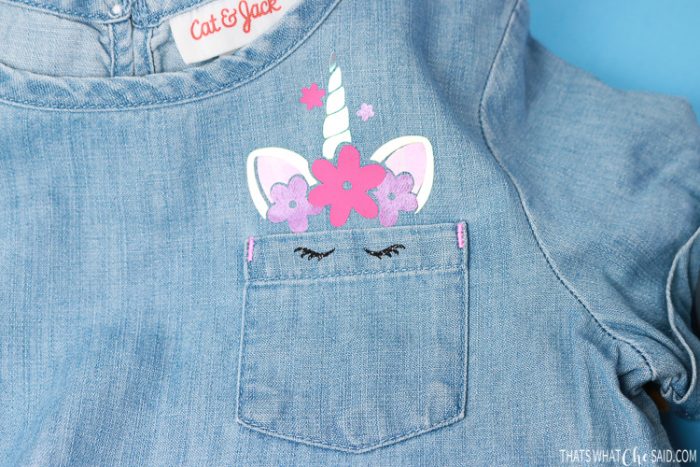 Denim girls shirt with unicorn peeking out of the pocket