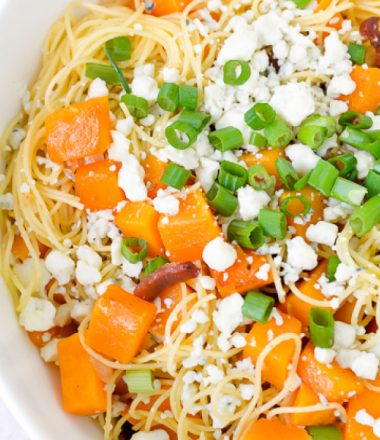 Close up view of butternut squash pasta with bacon and blue cheese