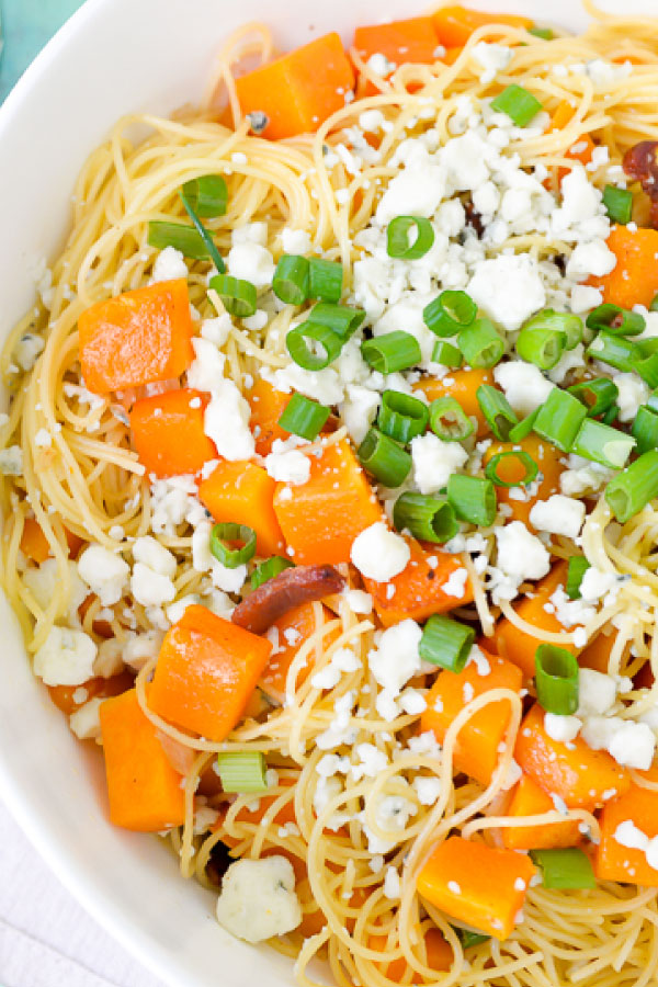 Close up view of butternut squash pasta with bacon and blue cheese