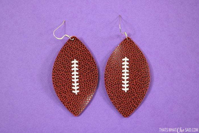 Football shaped earrings cut in faux football leather