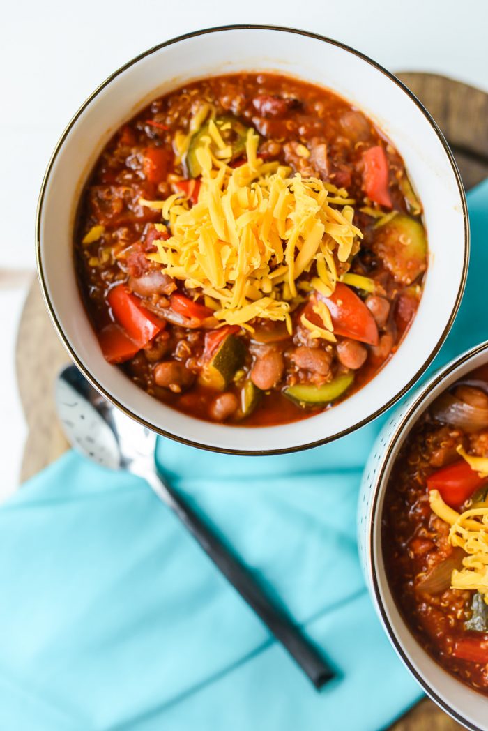 two bowls of vegetarian chili with cheese