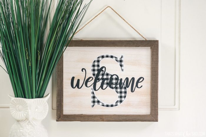 DIY welcome sign with adhesive vinyl and a personalized monogram