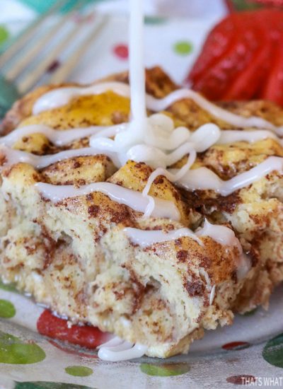 Cinnamon Roll French Toast Bake Close up with Icing being drizzled