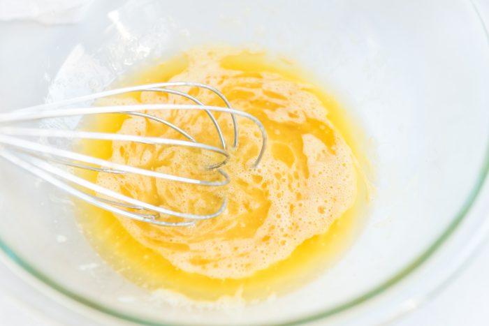 eggs and vanilla being whisked 