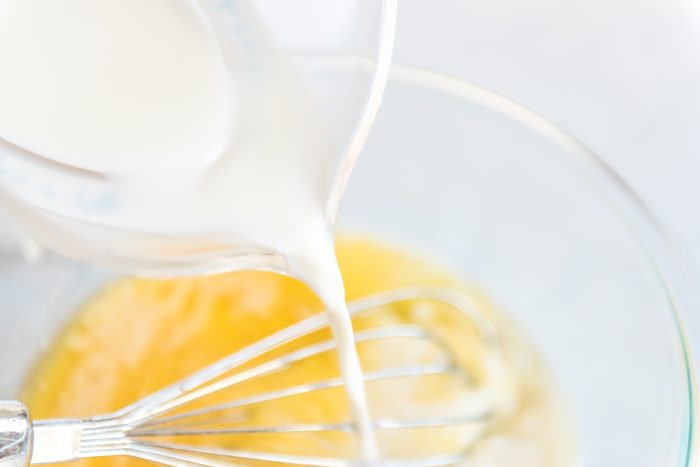 adding milk to egg mixture