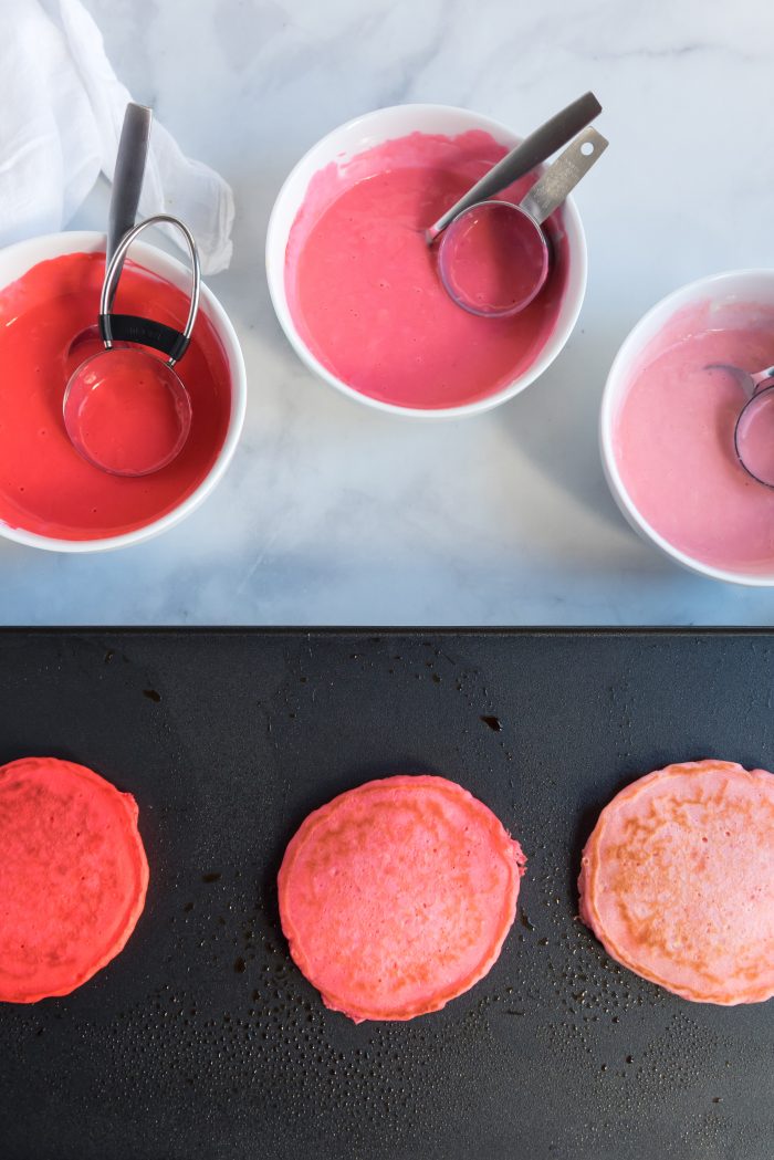 Cooked colored pancake on a griddle