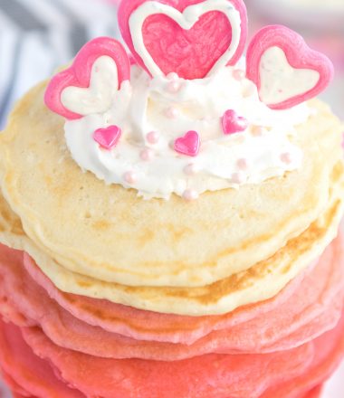Pancakes stacked from red, dark pink,pink and white