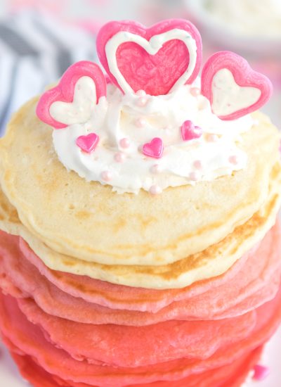 Pancakes stacked from red, dark pink,pink and white