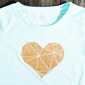 Mint green shirt with gold sparkly geometric heart design