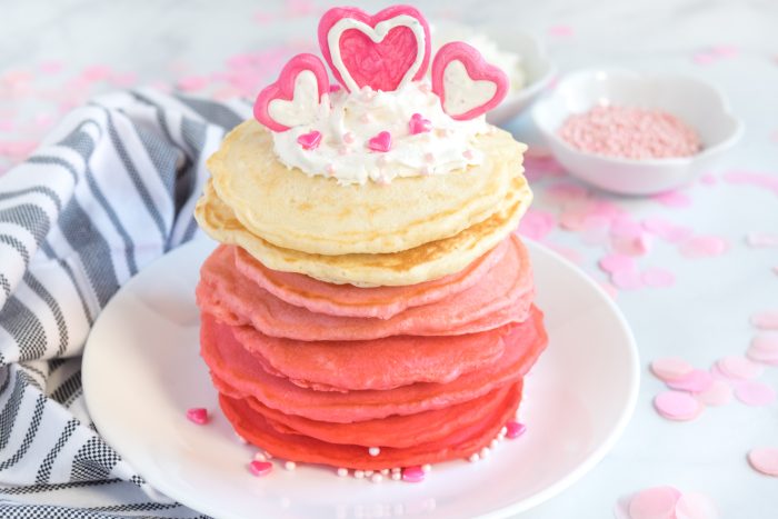 Red To Pink to white ombre pancakes with heart chocolate decoration for Valentine pancakes