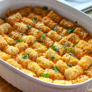 Cheeseburger Tatertot Casserole in white Oval casserole dish ready to be served