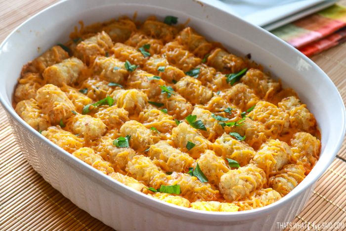 Cheeseburger Tatertot Casserole in white Oval casserole dish ready to be served