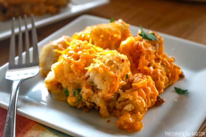 Cheeseburger Tatertot Casserole on a white plate ready to be eaten!