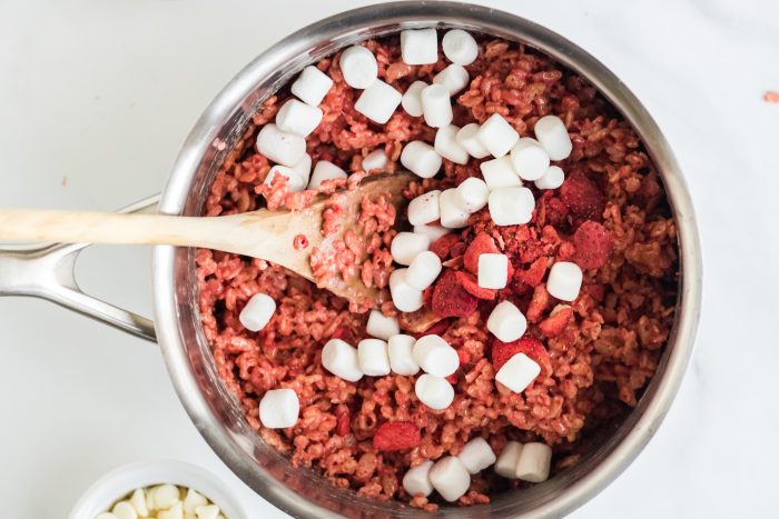 Mixing in marshmallows and freeze dried strawberries