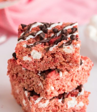 close up of Chocolate Covered Strawberry Rice Krispie Treats stacked three tall