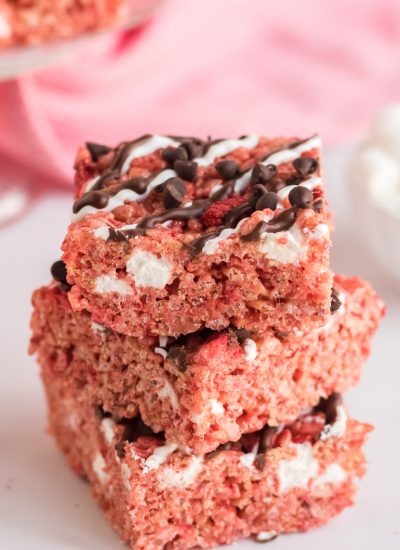 close up of Chocolate Covered Strawberry Rice Krispie Treats stacked three tall