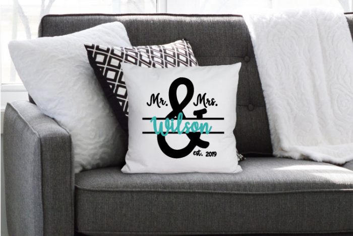 Grey couch with blanket and throw pillows and one has the Mr & Mrs in iron on for a personalized pillow!