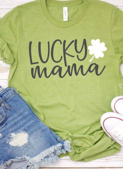 Green shirt with jean shorts and chuck taylors the shirt ha "Lucky Mama SVG design with 4 leaf clover"