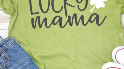 Green shirt with jean shorts and chuck taylors the shirt ha "Lucky Mama SVG design with 4 leaf clover"