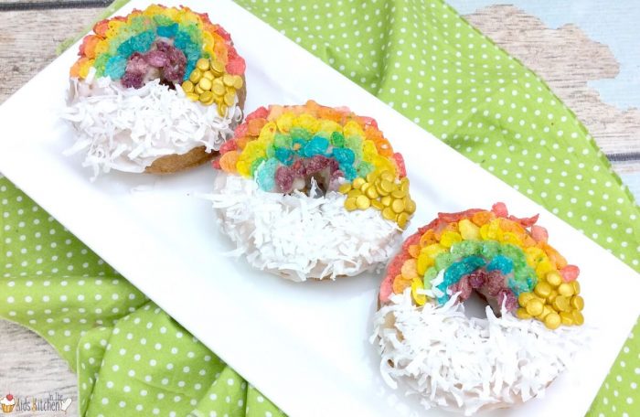 Air Fryer Donuts decorated with Fruity Pebbles in rainbows and coconut as clouds