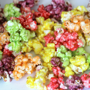 Popcorn with skittle candy coating in rainbow colors