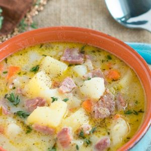 Close of up crock bowl with ham and potato soup