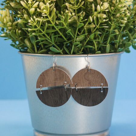 Semi Cirlce Earrings hanging on a faux plant pot
