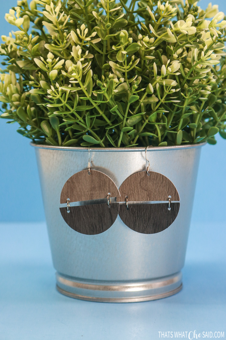 Semi Cirlce Earrings hanging on a faux plant pot