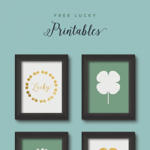 4 framed St. Patrick's Day Free Printables on a wall.