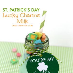 Green Milk with Lucky Charms marshmallows as a St. Patrick's day drink with free printable