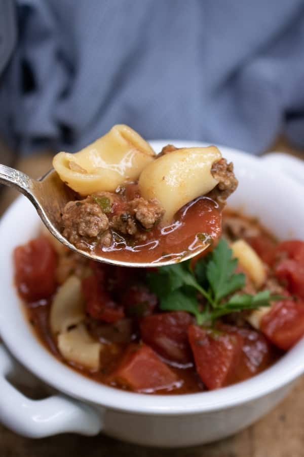 Close up of spoonful of beef tomato macaroni Instant pot soup