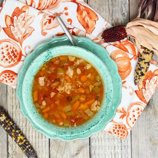 Chicken & Vegetable Bean Soup in aqua bowl on aqua plate with a napkin