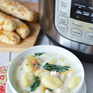 Gnocchi soup bowl with instant pot and breadsticks