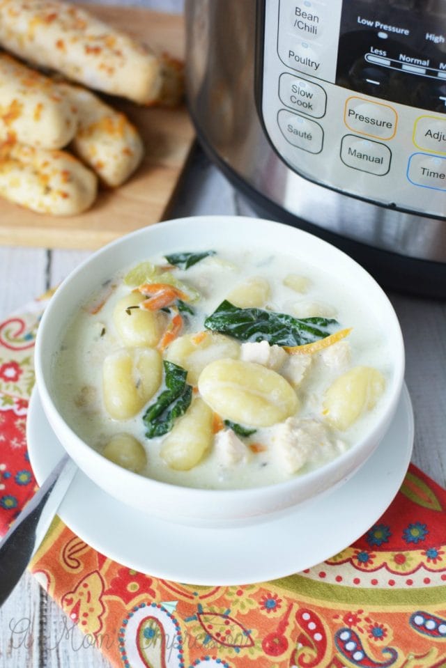 Gnocchi soup bowl with instant pot and breadsticks