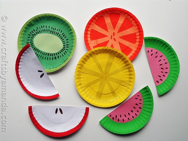 Paper plates painted as cut fruit.