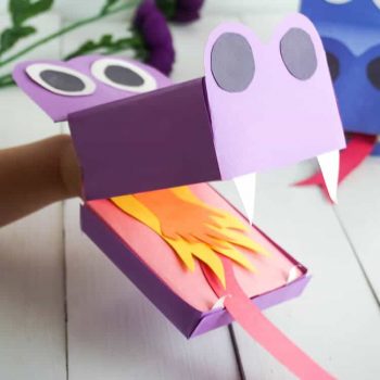 Cute dragon puppets cut out of construction paper with fiery tongues..