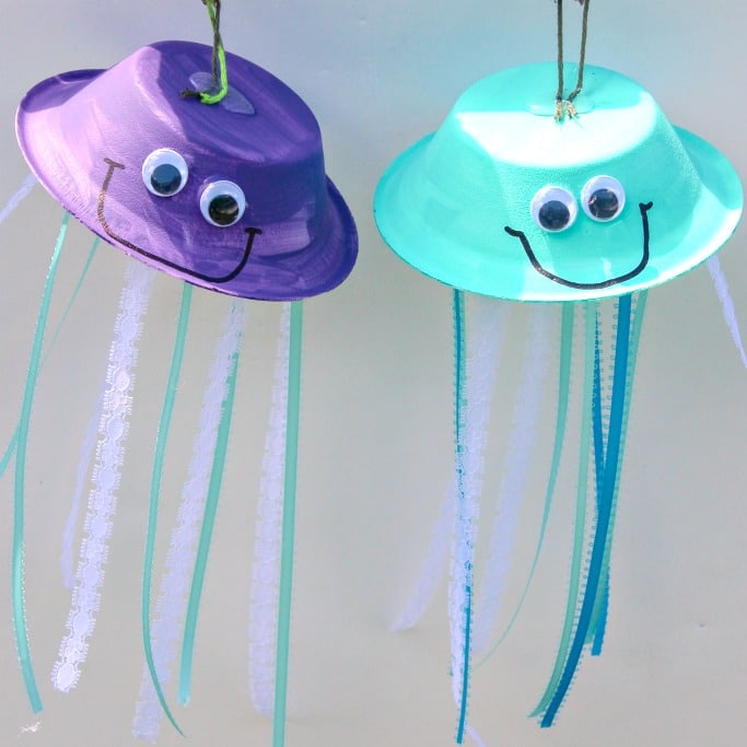 Paper bowls and ribbon made into hanging jellyfish crafts.