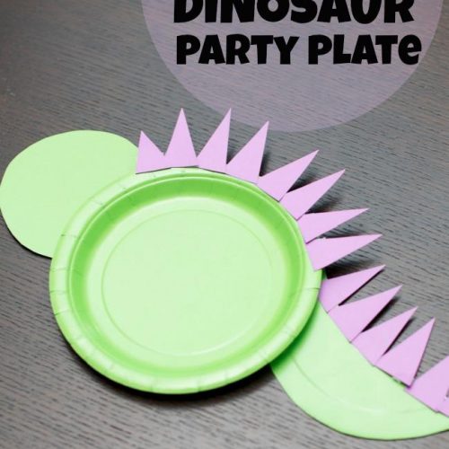 Paper plates cut into the shape of a dinosaur.