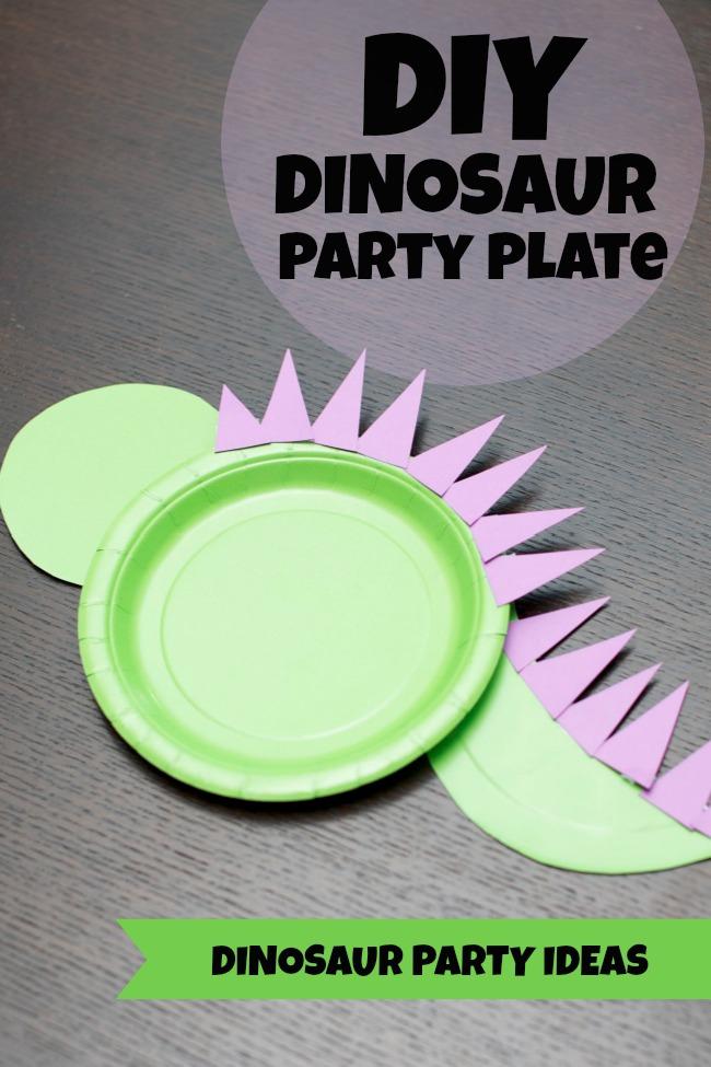 Paper plates cut into the shape of a dinosaur.