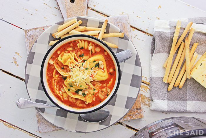 Horizontal Shot of soup with crunchy bread sticks on buffalo check plate with buffalo check napkin