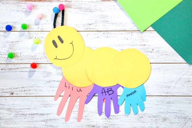 Circles and handprint cut outs out together in shape of a caterpillar.